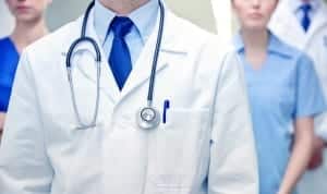 close up of medics or doctors at hospital
