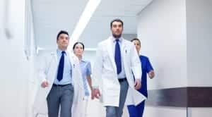 group of medics walking along hospital